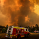 Firemen prepare as a bushfire approaches homes on the outskirts of the town of Bargo on December 21, 2019 in Sydney, Australia.